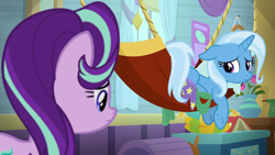Size: 1920x1080 | Tagged: safe, imported from derpibooru, screencap, starlight glimmer, trixie, pony, unicorn, a horse shoe-in, book, chest, female, flower, hammock, looking over shoulder, mare, sad, trixie's wagon, vase, wagon, window