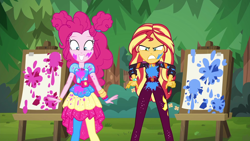 Size: 1920x1080 | Tagged: safe, imported from derpibooru, screencap, pinkie pie, sunset shimmer, equestria girls, equestria girls series, sunset's backstage pass!, spoiler:eqg series (season 2), angry, clothes, cute, diapinkes, duo, duo female, easel, female, geode of empathy, geode of sugar bombs, happy, magical geodes, messy, music festival outfit, outdoors, paint, pantyhose, shrunken pupils, smiling, sunset shimmer is not amused, unamused, varying degrees of amusement