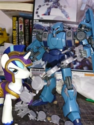 Size: 1080x1440 | Tagged: safe, artist:omegapony16, imported from derpibooru, shining armor, pony, unicorn, armor, book, guardians of harmony, gundam, gunpla, helmet, irl, male, mech, misadventures of the guardians, model kit, neo zeon, photo, schuzrum gallus, stallion, the sleeves, toy, unshorn fetlocks