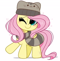 Size: 4012x4096 | Tagged: safe, artist:kittyrosie, imported from derpibooru, fluttershy, pegasus, pony, animal costume, blushing, cap, clothes, costume, cute, hat, looking at you, mouth hold, one eye closed, pusheen, scarf, shyabetes, simple background, solo, white background, winter cap