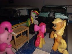 Size: 4160x3120 | Tagged: safe, imported from derpibooru, apple bloom, applejack, coconut cream, pinkie pie, ambulance, blind bag, cadillac, car, chevrolet bel air, everfree customs, garage, push cart, toy, workbench