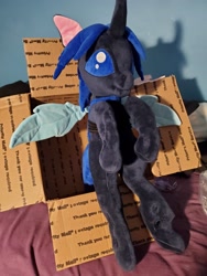 Size: 3024x4032 | Tagged: safe, artist:klplushies, imported from derpibooru, oc, oc only, oc:swift dawn, changeling, bed, bed bug, blue changeling, blue eyes, changeling in a box, changeling oc, cute, irl, photo, plushie, sitting, wings