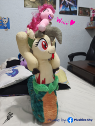 Size: 3024x4032 | Tagged: safe, artist:shappy the lamia, edit, imported from derpibooru, dj pon-3, pinkie pie, vinyl scratch, oc, oc:shappy, earth pony, hybrid, lamia, original species, plush pony, pony, semi-anthro, snake, bed, bedroom, caption, carrying, female, forked tongue, funny, happy, heart, hooves, image macro, irl, love, mother and child, mother and daughter, photo, pillow, plushie, plushies shy, poster, scales, slit eyes, slit pupils, smiley face, smiling, snake eyes, snake tail, snake tongue, text