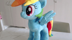 Size: 800x450 | Tagged: safe, artist:nekokevin, imported from derpibooru, imported from ponybooru, rainbow dash, pegasus, pony, animated, cute, dashabetes, female, gif, irl, looking at you, mare, nekokevin is trying to murder us, photo, plushie, smiling, solo, spread wings, stop motion, wings
