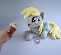 Size: 1400x1260 | Tagged: safe, artist:meplushyou, imported from derpibooru, derpy hooves, pegasus, pony, cute, derpabetes, food, hand, irl, lying down, muffin, photo, plushie, prone, solo