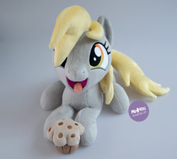 Size: 1400x1259 | Tagged: safe, artist:meplushyou, imported from derpibooru, derpy hooves, pegasus, pony, cute, derpabetes, food, irl, lying down, muffin, photo, plushie, prone, solo, tongue out