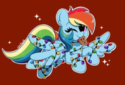 Size: 3200x2176 | Tagged: safe, artist:kittyrosie, imported from derpibooru, rainbow dash, pegasus, pony, christmas, christmas lights, cookie, cute, dashabetes, digital art, female, food, holiday, mare, mouth hold, one eye closed, simple background, smiling, solo, wink