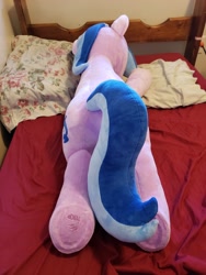 Size: 3024x4032 | Tagged: safe, artist:nekokevin, imported from derpibooru, sea swirl, seafoam, pony, unicorn, background pony, bed, cute, irl, lying down, on stomach, photo, pillow, plushie, prone, solo, underhoof