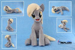 Size: 1280x854 | Tagged: safe, artist:nekokevin, imported from derpibooru, derpy hooves, pegasus, pony, :d, cute, derpabetes, female, irl, looking at you, lying down, mare, obtrusive watermark, open mouth, photo, plushie, prone, side view, sitting, smiling, solo, underhoof, watermark