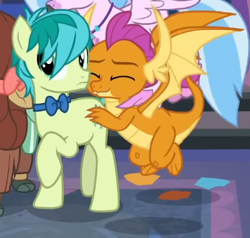 Size: 391x372 | Tagged: safe, imported from derpibooru, screencap, sandbar, silverstream, smolder, yona, dragon, earth pony, hippogriff, pony, yak, she's all yak, bowtie, butt grab, butt touch, cropped, duo focus, eyes closed, female, grope, male, midair, offscreen character, raised hoof