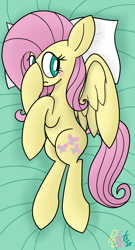 Size: 990x1832 | Tagged: safe, artist:notadeliciouspotato, imported from derpibooru, fluttershy, pegasus, pony, bed, blushing, body pillow, covering face, female, frown, hoof on head, lying down, mare, on side, pillow, side, signature, solo, spread wings, wings