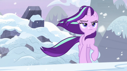 Size: 1920x1080 | Tagged: safe, imported from derpibooru, screencap, starlight glimmer, pony, unicorn, the ending of the end, badass, female, frown, lidded eyes, mare, raised hoof, snow, snowfall, solo, walking away, windswept mane