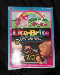 Size: 829x1023 | Tagged: safe, imported from derpibooru, heart throb, truly, butterfly, human, unicorn, black background, bow, cute, flower, g1, heartthrobetes, horses doing horse things, irl, irl human, lite brite, merchandise, milton bradley, official, photo, rolling, simple background, tail bow, trulybetes