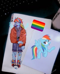 Size: 960x1190 | Tagged: safe, artist:moonfroyos, imported from derpibooru, rainbow dash, pegasus, pony, equestria girls, bandage, belt, bubble tea, clothes, gay pride flag, hairy legs, headcanon, irl, jacket, lesbian pride flag, lgbt headcanon, pants, photo, pride, pride flag, rainbow socks, sexuality headcanon, shirt, shorts, socks, solo, striped socks