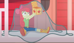 Size: 1482x857 | Tagged: safe, imported from derpibooru, screencap, apple bloom, equestria girls, equestria girls series, holidays unwrapped, spoiler:eqg series (season 2), adorabloom, apple bloom's bow, boots, bow, box, caught, clothes, cropped, cute, female, hair bow, house, jack in the box, jack-in-the-box, jeans, lifting, net, pants, shirt, shoes, sitting, solo, surprised, the cider louse fools