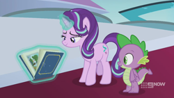 Size: 1280x720 | Tagged: safe, imported from derpibooru, screencap, spike, starlight glimmer, dragon, pony, unicorn, memories and more, spoiler:memories and more, spoiler:mlp friendship is forever, 9now, book, levitation, magic, magic aura, scrapbook, telekinesis, winged spike, wings