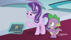 Size: 1280x720 | Tagged: safe, imported from derpibooru, screencap, spike, starlight glimmer, dragon, pony, unicorn, memories and more, spoiler:memories and more, spoiler:mlp friendship is forever, 9now, book, crossed arms, duo, levitation, magic, magic aura, scrapbook, telekinesis, winged spike, wings