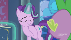 Size: 1280x720 | Tagged: safe, imported from derpibooru, screencap, spike, starlight glimmer, dragon, pony, unicorn, memories and more, spoiler:memories and more, spoiler:mlp friendship is forever, 9now, book, duo, eyes closed, levitation, magic, magic aura, mid-blink screencap, scrapbook, smiling, telekinesis, winged spike, wings