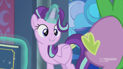 Size: 1280x720 | Tagged: safe, imported from derpibooru, screencap, spike, starlight glimmer, dragon, pony, unicorn, memories and more, spoiler:memories and more, spoiler:mlp friendship is forever, 9now, book, duo, levitation, looking at each other, magic, magic aura, scrapbook, smiling, telekinesis, winged spike, wings