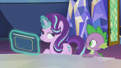 Size: 1280x720 | Tagged: safe, imported from derpibooru, screencap, spike, starlight glimmer, dragon, pony, unicorn, memories and more, spoiler:memories and more, spoiler:mlp friendship is forever, 9now, bedroom eyes, book, duo, levitation, magic, magic aura, mid-blink screencap, scrapbook, smiling, smug, telekinesis, winged spike, wings