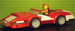 Size: 1024x423 | Tagged: safe, artist:grapefruitface1, imported from derpibooru, sunset shimmer, equestria girls, car, irl, lego, lego car, minifig, photo, solo, toy