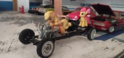 Size: 3264x1546 | Tagged: safe, imported from derpibooru, apple bloom, applejack, blind bag, chassis, chevrolet impala, engine, everfree customs, female, ford crown victoria police interceptor, garage, irl, mechanic, photo, pontiac gto, toy, v8, volkswagen beetle