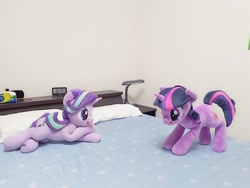 Size: 2048x1536 | Tagged: safe, artist:nekokevin, imported from derpibooru, starlight glimmer, twilight sparkle, pony, unicorn, series:nekokevin's glimmy, alarm clock, bed, clock, crossed hooves, duo, female, irl, lying down, mare, open mouth, photo, pillow, plushie, ponies in real life, smiling, underhoof, unicorn twilight