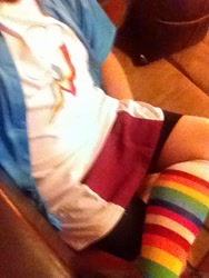 Size: 480x640 | Tagged: safe, imported from derpibooru, photographer:mr.sparkle, rainbow dash, human, bike shorts, clothes, crossdressing, crossplay, cutie mark, irl, irl human, legs, photo, rainbow socks, shirt, shorts, shorts under skirt, sitting, skirt, socks, solo, striped socks