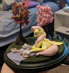 Size: 578x606 | Tagged: safe, artist:blackdawnyaoilover, imported from derpibooru, fluttershy, pegasus, pony, cake, cookie, craft, cup, food, irl, lying down, on side, photo, picnic, sculpture, solo, teacup, teapot, traditional art