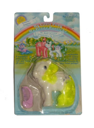 Size: 748x1023 | Tagged: safe, imported from derpibooru, photographer:collector1, baby surprise, buttons (g1), surprise, comb, female, french, g1, irl, packaging, photo, simple background, so soft pony, surprise (g1), toy, white background