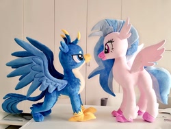 Size: 1024x768 | Tagged: safe, artist:nekokevin, imported from derpibooru, gallus, silverstream, classical hippogriff, griffon, hippogriff, duo, female, irl, lidded eyes, looking at each other, male, photo, plushie, size difference, smiling, spread wings, wings