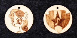 Size: 1024x513 | Tagged: safe, artist:malte279, imported from derpibooru, sweetie belle, pony, unicorn, craft, cutie mark, female, filly, jewelry, pendant, pyrography, the cmc's cutie marks, traditional art, wood