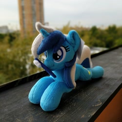 Size: 1944x1944 | Tagged: safe, artist:burgunzik, imported from derpibooru, minuette, pony, unicorn, irl, lying down, mouth hold, photo, plushie, prone, solo, toothbrush