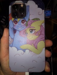 Size: 3024x4032 | Tagged: safe, artist:silbersternenlicht, imported from derpibooru, fluttershy, rainbow dash, pegasus, pony, female, flutterdash, iphone case, iphone12maxpro, lesbian, phone case, photo, shipping, shipping fuel