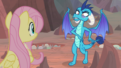 Size: 1920x1080 | Tagged: safe, imported from ponybooru, screencap, fluttershy, princess ember, dragon, pegasus, pony, sweet and smoky, blushing, dragon egg, dragoness, duo, egg, faic, female, holding a dragon, holding an egg, hoof hold, looking at each other, mare, out of context, shrunken pupils, spread wings, wings