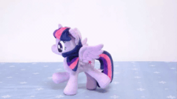 Size: 853x480 | Tagged: safe, artist:nekokevin, imported from derpibooru, twilight sparkle, alicorn, pony, 4de, animated, female, gif, happy, irl, mare, plushie, raised hoof, raised leg, smiling, solo, spread wings, stop motion, twilight sparkle (alicorn), wings