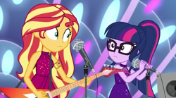 Size: 1920x1068 | Tagged: safe, imported from derpibooru, screencap, sci-twi, sunset shimmer, twilight sparkle, equestria girls, equestria girls series, spring breakdown, spoiler:eqg series (season 2), bare shoulders, electric guitar, guitar, microphone, microphone stand, musical instrument, shrunken pupils, sleeveless, speaker, stage