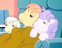 Size: 1402x1080 | Tagged: safe, imported from derpibooru, screencap, earth pony, pony, my little pony tales, too sick to notice, amber (g1), baseball cap, big brother, blanket, blue eyes, cap, chair, colt, cuddling, female, filly, foal, freckles, g1, green eyes, hat, huddle, little brother, little sister, male, pink eyes, purple hair, recliner, rusty (g1), siblings, sick, twink (g1), under blanket, white hair, yellow coat