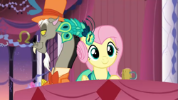 Size: 1397x786 | Tagged: safe, imported from derpibooru, screencap, discord, fluttershy, draconequus, pony, make new friends but keep discord, season 5, bowtie, clothes, dress, female, gala dress, grand galloping gala, hat, male, mug, screenshots, table, top hat