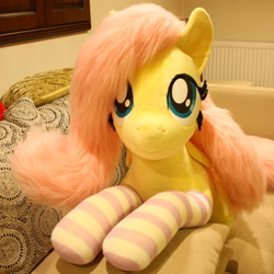 Size: 3247x3247 | Tagged: safe, artist:ponimalion, imported from derpibooru, fluttershy, pegasus, pony, bed, clothes, female, high res, irl, life size, mare, photo, plushie, socks, solo, striped socks