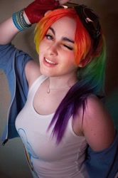 Size: 716x1080 | Tagged: safe, imported from derpibooru, rainbow dash, human, bracelet, clothes, cosplay, costume, cutie mark on clothes, goggles, irl, irl human, jewelry, looking at you, multicolored hair, one eye closed, photo, rainbow hair, tanktop, wink, winking at you