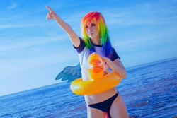 Size: 1080x722 | Tagged: safe, artist:natsumipon, imported from derpibooru, rainbow dash, human, beach, clothes, cosplay, costume, floaty, irl, irl human, photo, pointing, swimsuit