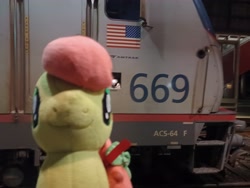 Size: 4000x3000 | Tagged: safe, artist:topsangtheman, imported from derpibooru, peachy sweet, earth pony, pony, amtrak, apple family member, irl, looking at you, photo, plushie, solo, train