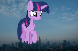 Size: 1802x1197 | Tagged: safe, artist:dashiesparkle, artist:thegiantponyfan, imported from derpibooru, twilight sparkle, alicorn, pony, female, folded wings, giant alicorn, giant pony, giantess, highrise ponies, irl, kuala lumpur, macro, malaysia, mare, mega giant, photo, ponies in real life, raised hoof, smiling, twilight sparkle (alicorn), twizilla, wings