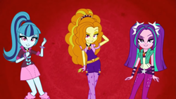 Size: 1397x786 | Tagged: safe, imported from derpibooru, screencap, adagio dazzle, aria blaze, sonata dusk, equestria girls, rainbow rocks, arm behind head, battle of the bands, dreamworks face, female, grin, looking at you, smiling, smiling at you, the dazzlings, trio, trio female, youtube link