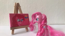 Size: 750x421 | Tagged: safe, artist:lillycloudart, imported from derpibooru, pinkie pie, earth pony, pony, canvas, female, grin, irl, mare, photo, smiling, toy, traditional art