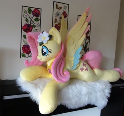 Size: 1140x1069 | Tagged: safe, artist:purplenebulastudios, imported from derpibooru, fluttershy, pegasus, pony, colored wings, cute, irl, life size, lying down, multicolored wings, photo, plushie, prone, shyabetes, solo, wings