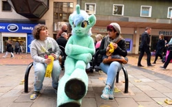 Size: 800x498 | Tagged: safe, imported from derpibooru, lyra heartstrings, bench, birmingham, defictionalization, fursuit, irl, meme, photo, ponysuit, sitting, sitting lyra, united kingdom