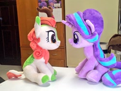 Size: 1024x768 | Tagged: safe, artist:nekokevin, imported from derpibooru, autumn blaze, starlight glimmer, kirin, pony, unicorn, series:nekokevin's glimmy, cloven hooves, duo, female, irl, looking at each other, mare, photo, plushie, sitting, table, underhoof