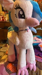 Size: 1980x3520 | Tagged: safe, artist:mezairplush, imported from derpibooru, photographer:savygriffs, silverstream, hippogriff, bed, female, irl, jewelry, necklace, photo, plushie